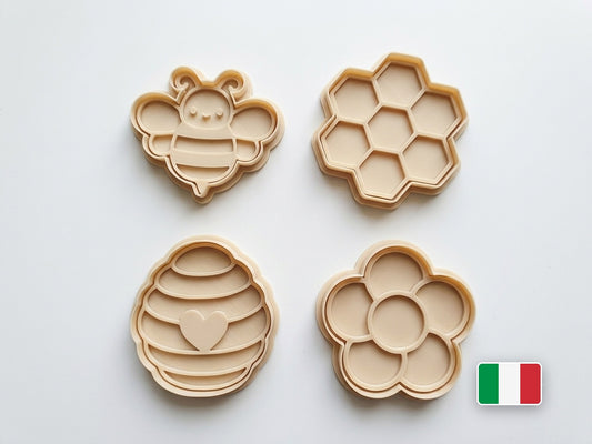 Set di 4 tagliabiscotti a tema ape: ape, favo, arnia e fiore in PLA avorio
